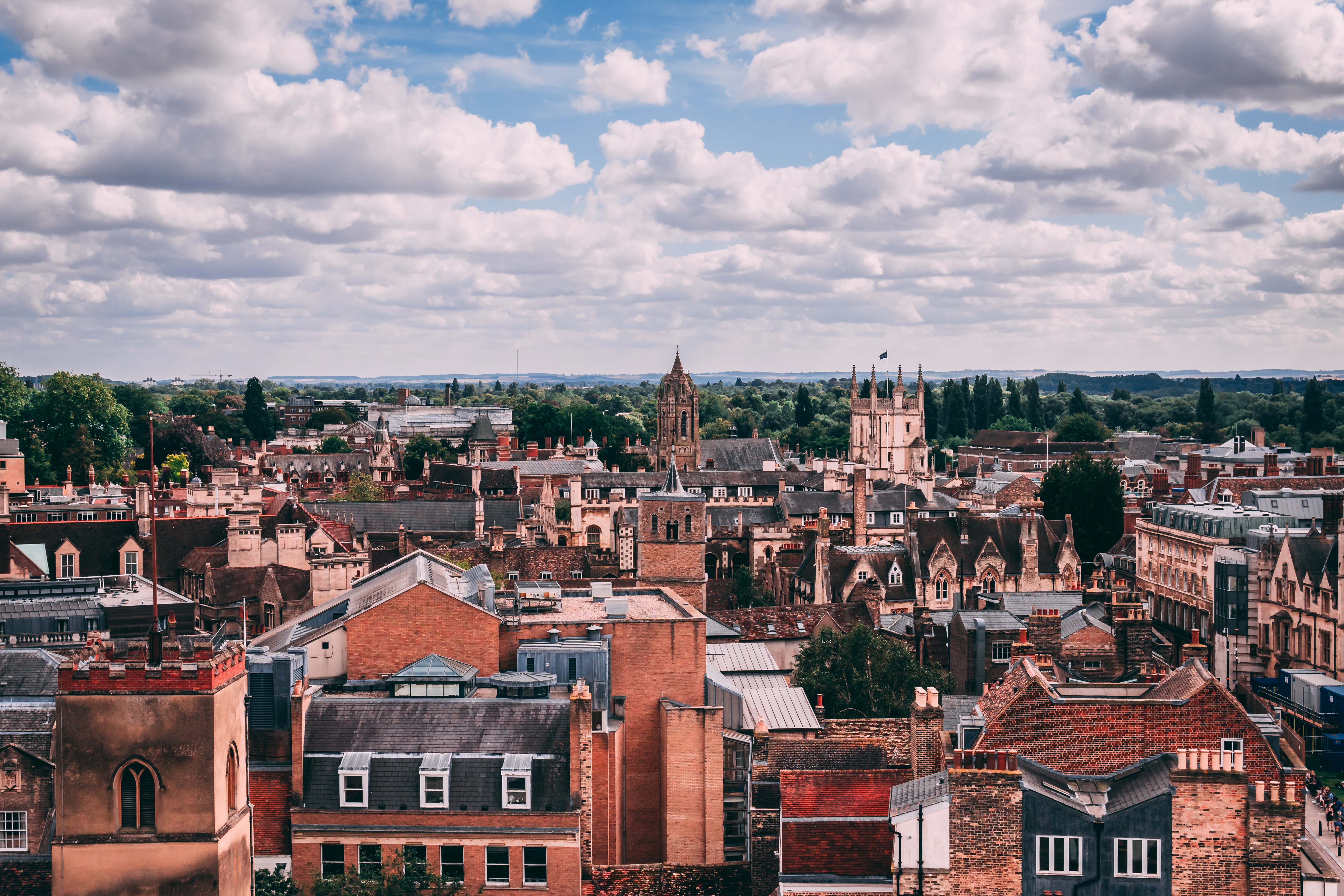 The buildings of Cambridge stretch out into the distance, on a cloudy day