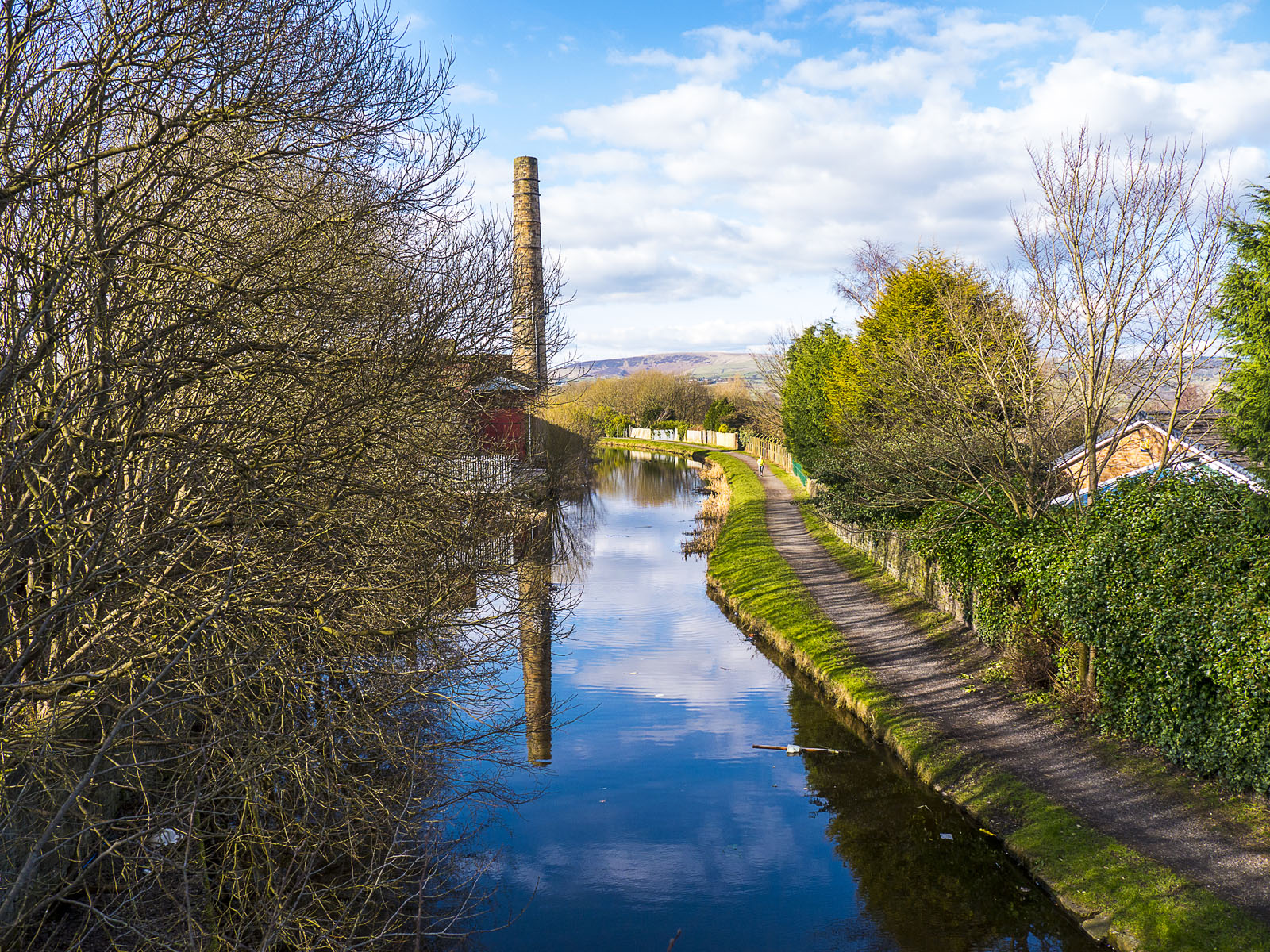 Sunny view of river with Burnley in background