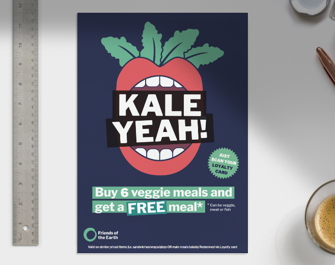 Kale Yeah! poster on a table surface with a ruler showing its size