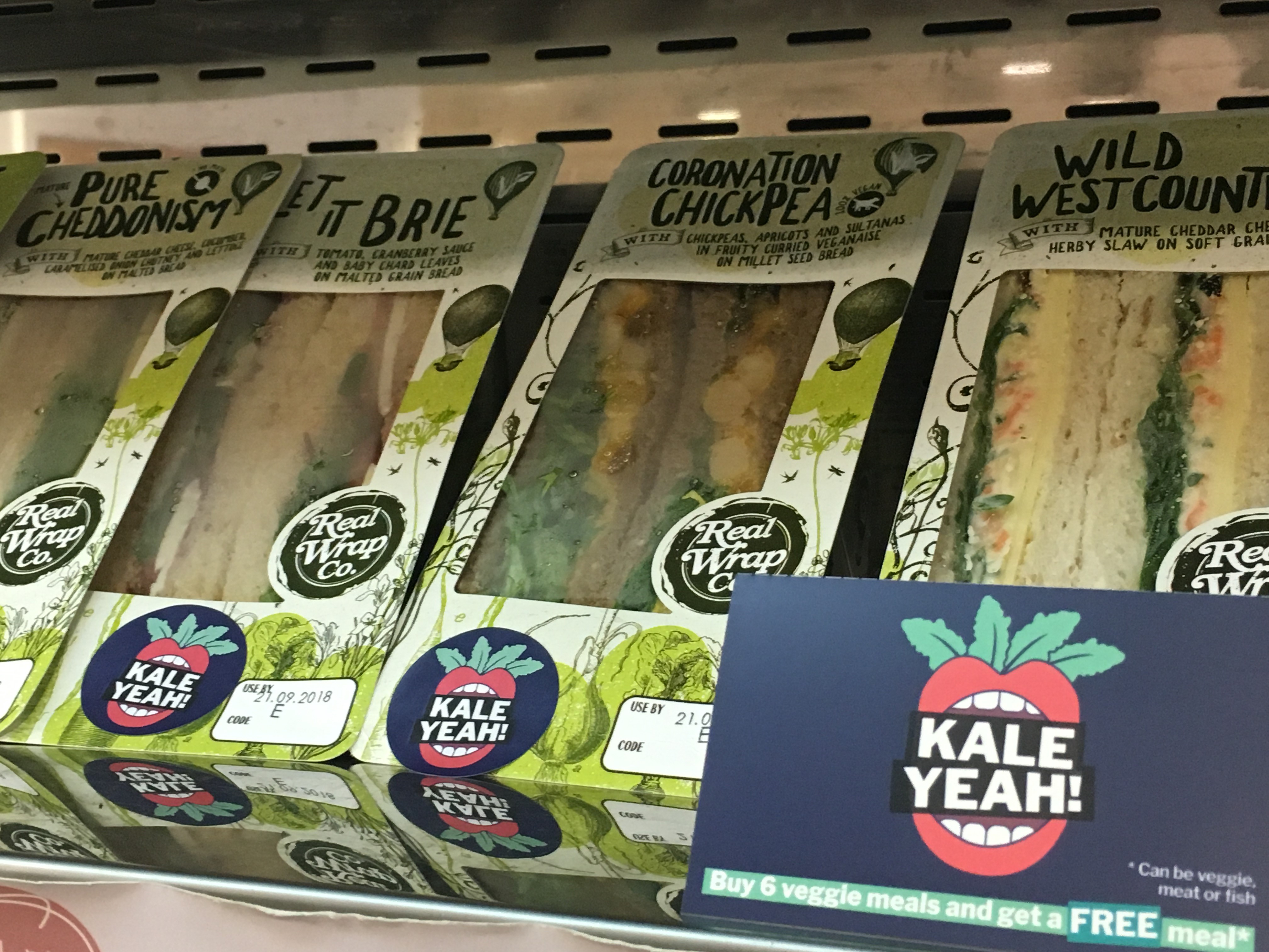 Kale Yeah! sandwiches with a loyalty card in front of them