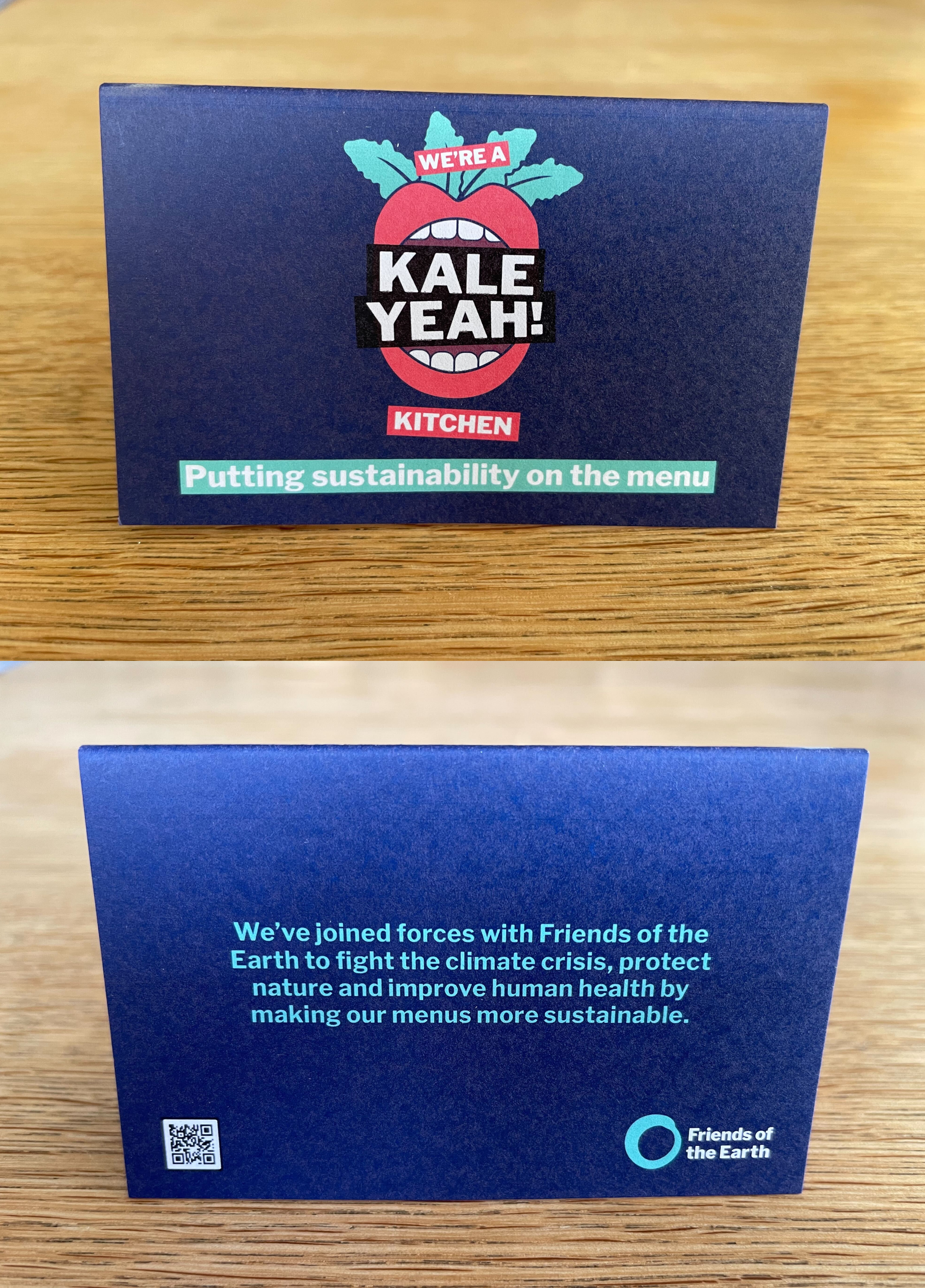The front and back of the Kale Yeah! tent card, with information about the scheme