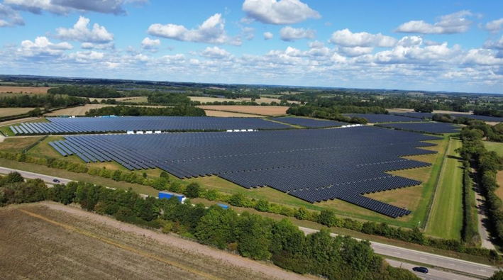 An aerial view of a ground-mounted solar farm