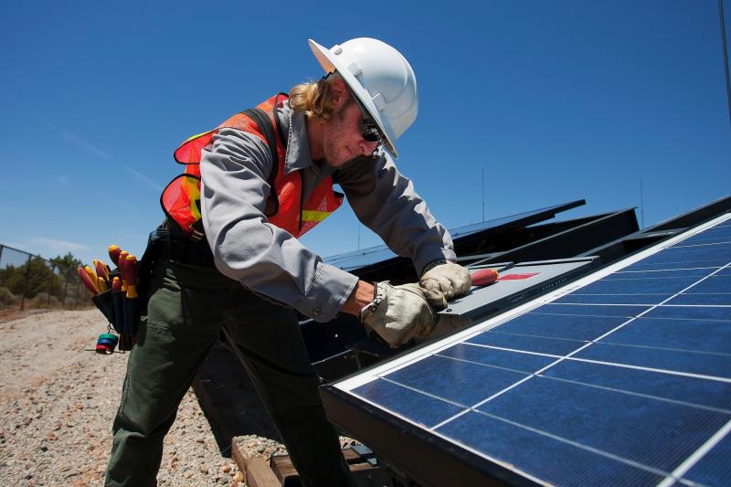 Man installing solar panel