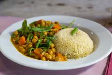 Chickpea and couscous vegan curry in a white bowl