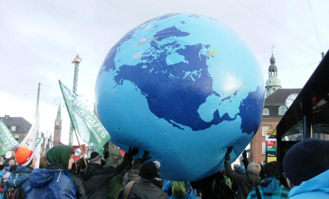 Protesters with a giant globe