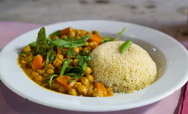 Chickpea and couscous vegan curry in a white bowl