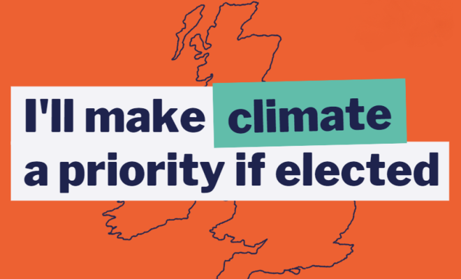 An orange pledge sign with an outline of the UK in the background and the words "I'll make climate a priority if elected"